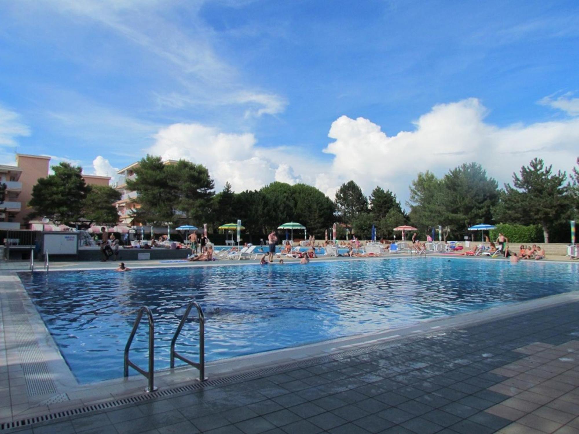 With Balcony In A With Pool Bibione