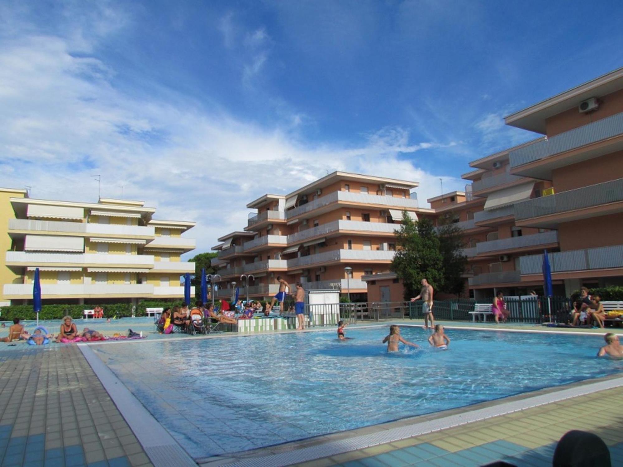 With Balcony In A With Pool Bibione